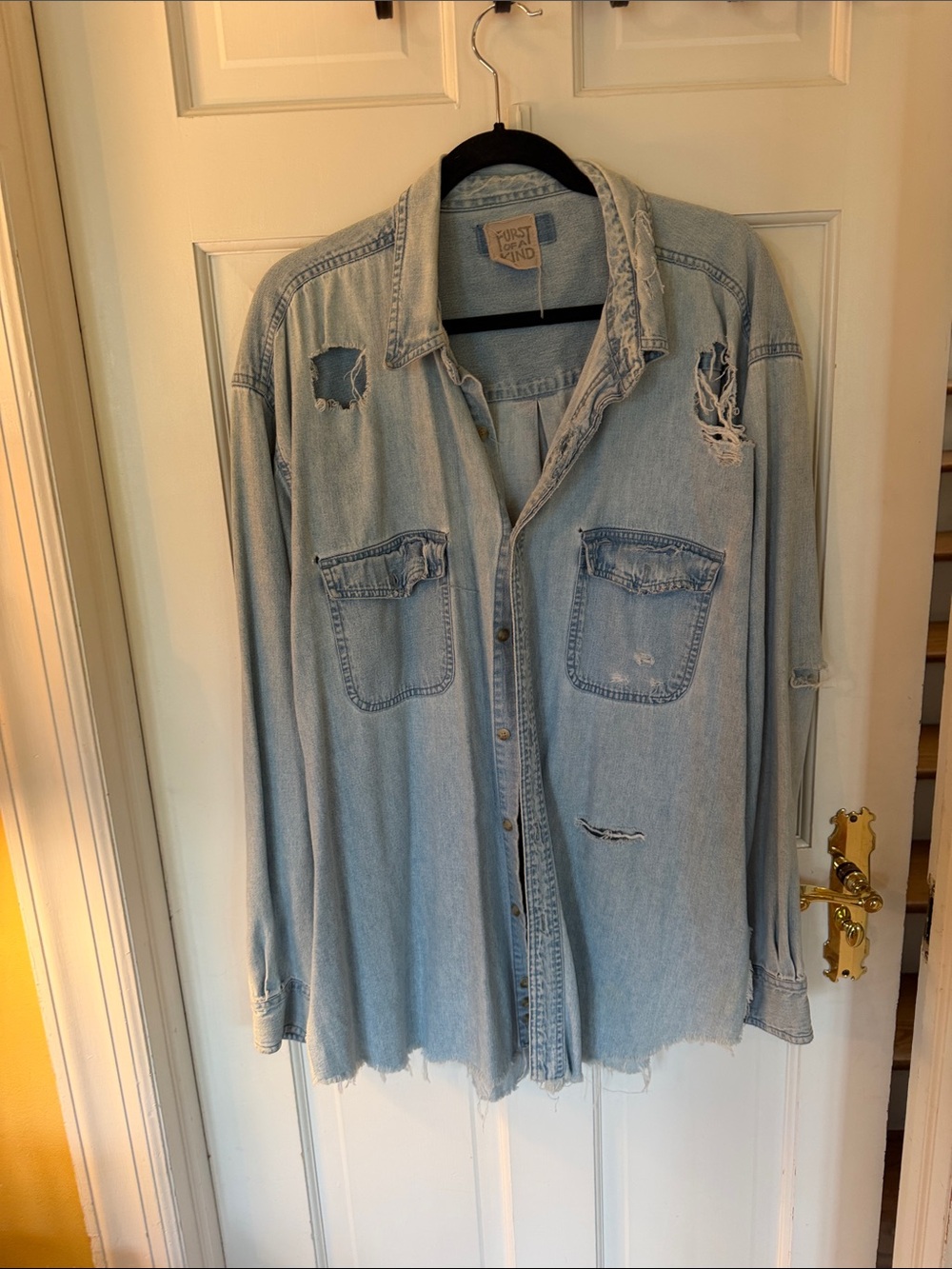 Woman’s Light Blue Distressed Denim Shirt